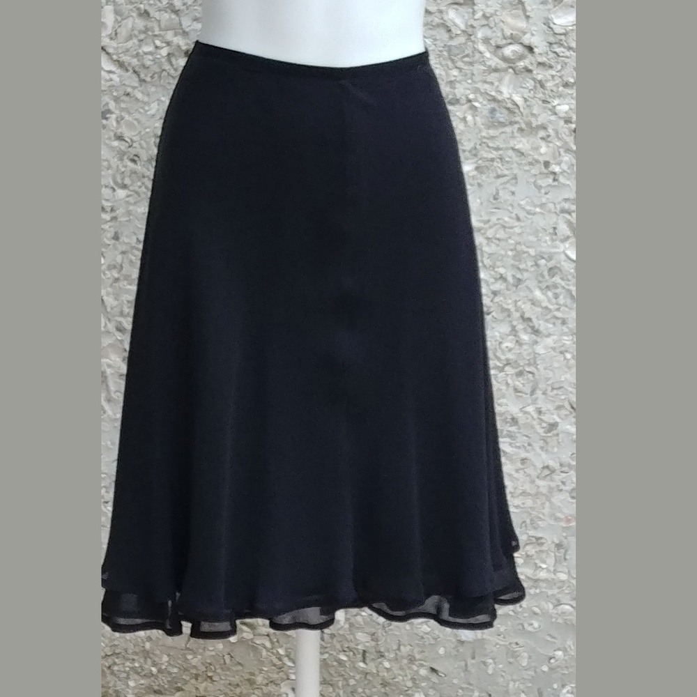 Black crepe skirt with flirty swirl hem